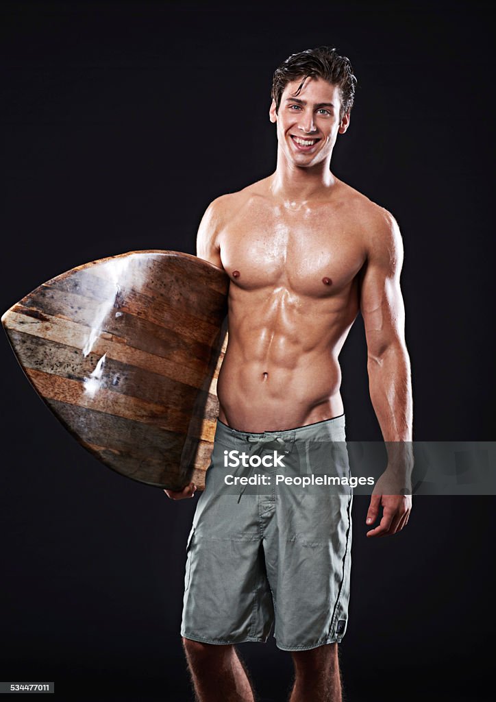 Wave rider with a great smile Studio shot of a young surfer with a vintage boardhttp://195.154.178.81/DATA/shoots/ic_784770.jpg 2015 Stock Photo