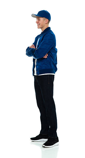 istock Cheerful male standing with arms crossed 534477416