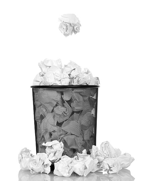 istock Metallic black trash from  paper isolated on white background 534480054