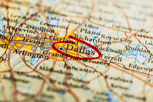Dallas circled with red marker on map. Close up shot.