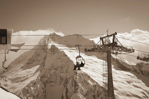 Ropeway at ski resort. Caucasus Mountains, region Dombay. Toned landscape.