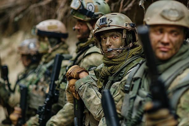 istock sniper stands with arms and looks forward 534480901