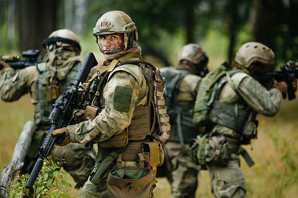 istock soldiers standing with arms and looks back 534481477
