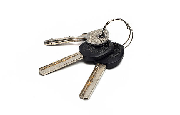 istock bunch of old, worn keys on white 534481963