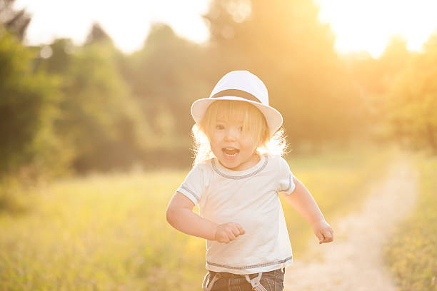 istock Happy little boy running in a park 534483014