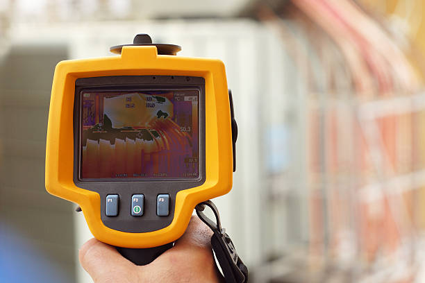 istock Infrared Thermal Imaging Camera Pointing to Electrical Transformer 534484454
