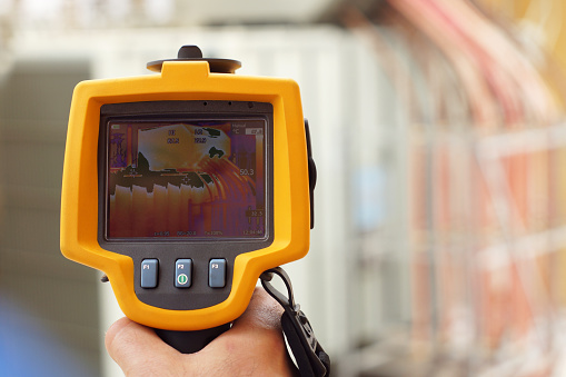Infrared Thermal Imaging Camera Pointing to Electrical Transformer