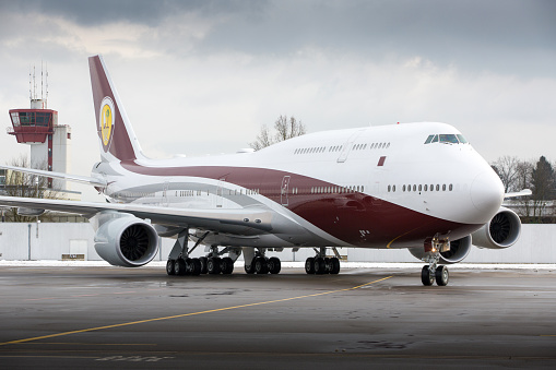 Zürich, Switzerland - January 27, 2015: Qatar Amiri Flight Boeing 747-8 BBJ (VQ-BSK) airplane parked at Zurich Inernational Airport. Qatar Amiri Flight is a VIP airline owned and operated by the government of Qatar. It operates worldwide charters on demand and caters exclusively to the royal family of Qatar and other VIP government staff. The vast majority of its fleet is painted in the standard livery of the commercial flag carrier of Qatar, Qatar Airways.