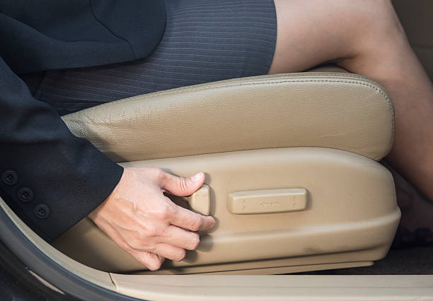 electric seat Businesswoman adjusts power seats, seat in the car adjusting seat stock pictures, royalty-free photos & images