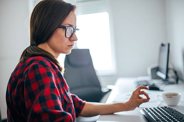 istock Girl with glasses in office 534502236