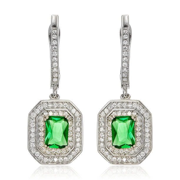 istock Silver earrings with emeralds isolated on white 534502576