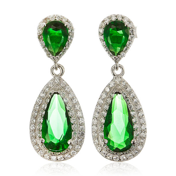 istock Silver earrings with emeralds isolated on white 534502624