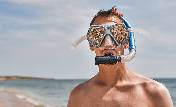 istock scuba diver with funny swimming goggles 534502802
