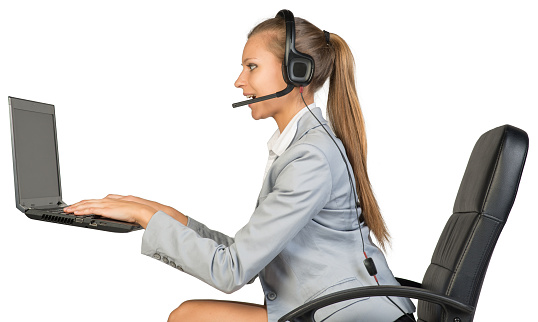 Young happy businesswoman with headset