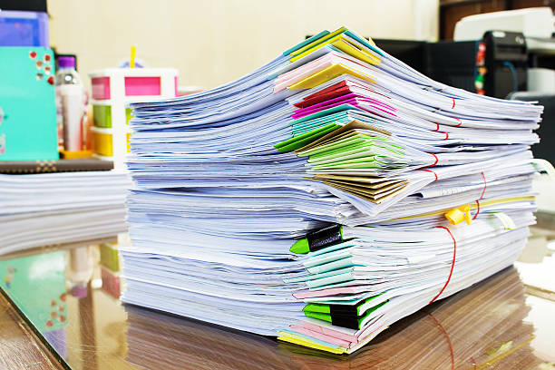 istock Stack of business report paper files with black clips 534503754