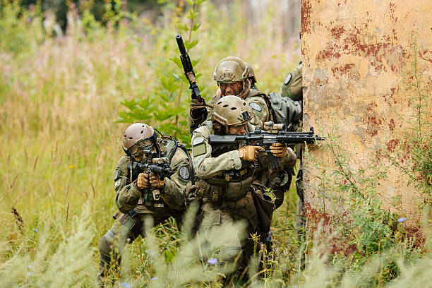 istock group of soldiers attacking from behind cover 534505071