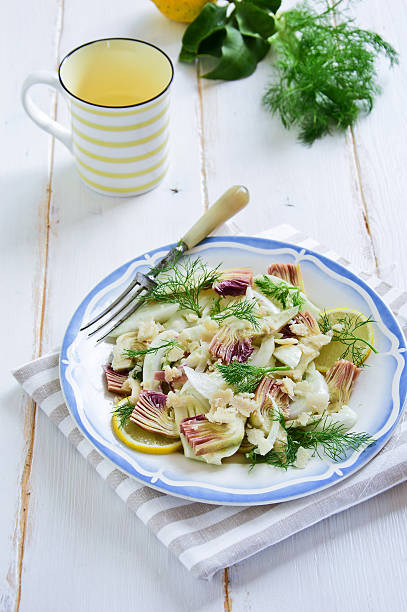 Fennel and artichoke salad with Parmesan cheese. Italian cuisine. stock photo