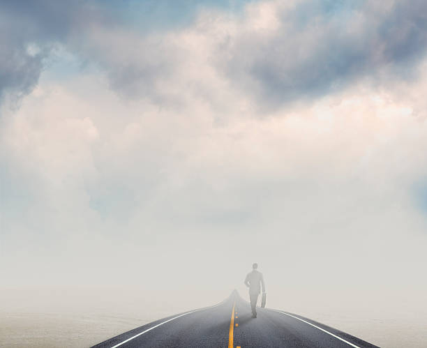 istock Businessman Walking Down Road In Sandstorm 534507609
