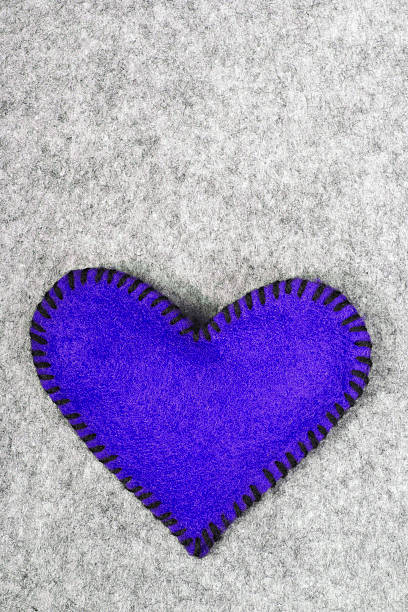 istock blue felt heart on a gray background 534534377