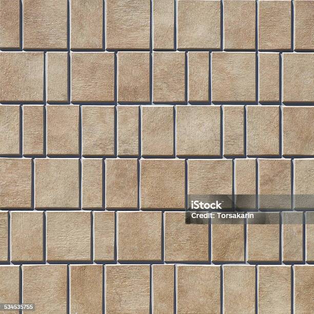 Brown Stone Tile Wall Seamless Background And Texture Stock Photo - Download Image Now