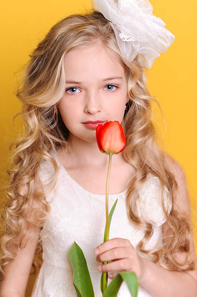 istock Beautiful kid girl with tulip 534539137