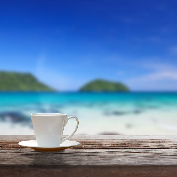 istock Cup of coffee on wooden table 534540673