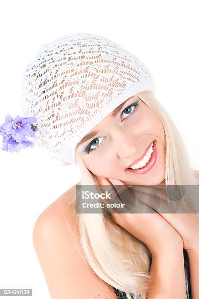 Blond Girl With A Bouquet Of Violets Stock Photo - Download Image Now - 18-19 Years, 20-24 Years, 2015