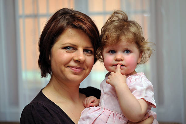 istock Mother holding her dauther in one's arms 534541193