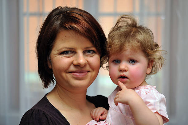 istock Mother holding her dauther in one's arms 534541195