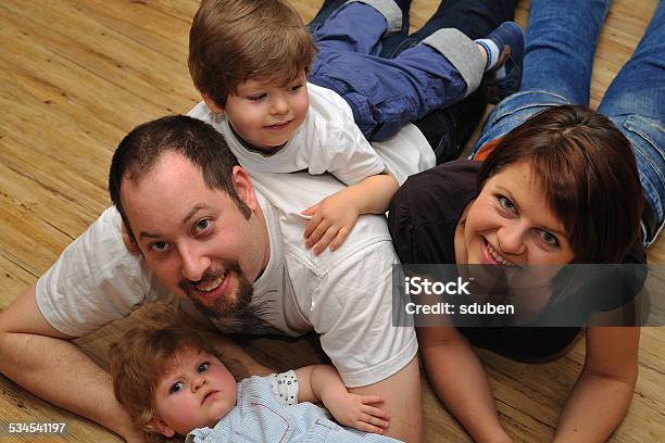 Portrait Of Happy Family At Home Stock Photo - Download Image Now - Adult, Baby - Human Age, Baby Girls