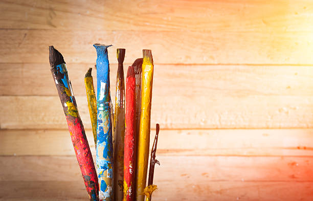 istock Used artist paintbrushes on wood background 534541945