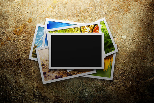 istock Pile of colorful photos with blank frame 534542075