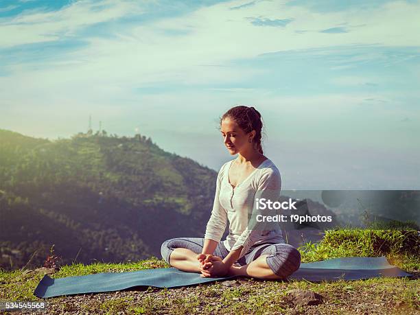 Sporty Fit Woman Practices Yoga Asana Baddha Konasana Outdoors Stock Photo - Download Image Now
