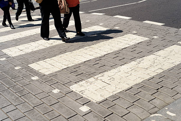 istock People Walking Across a Pedestrian Zebra Crossing 534545594