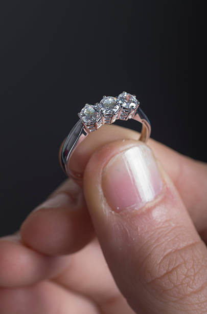 istock Choosing pearls necklaces and diamonds rings 534545898