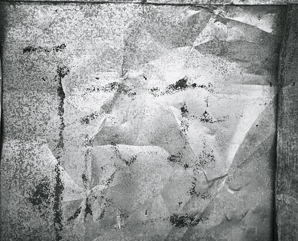 istock Crumpled empty shiny silver aluminum sheet metal texture background 534546232