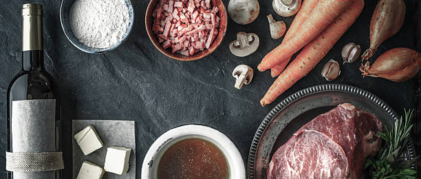 istock Ingredients for Boeuf Bourguignon on  dark stone  table wide screen 534548362