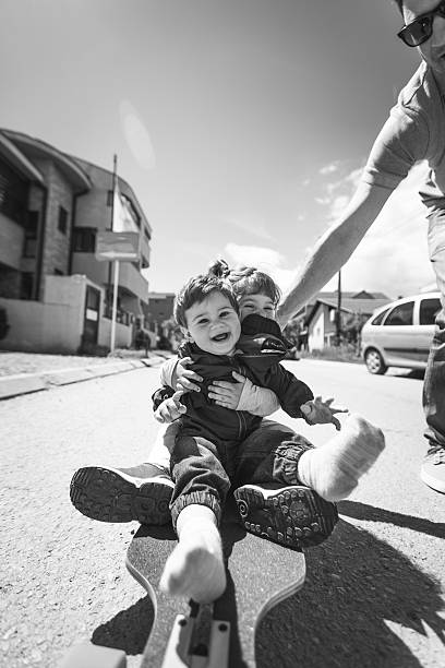 A father with his son playing together in the courtyard during pandemic lockdown in Italy