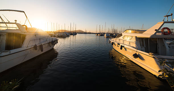 istock boats in Alghero harbor at sunset 534557422