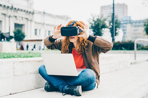 istock Young beautiful redhead caucasian business woman using 3D viewer 534559658