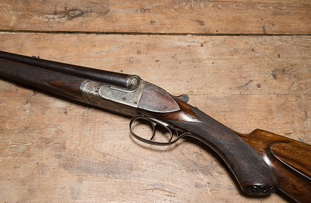 istock Antique hunting gun on a wooden background 534559708