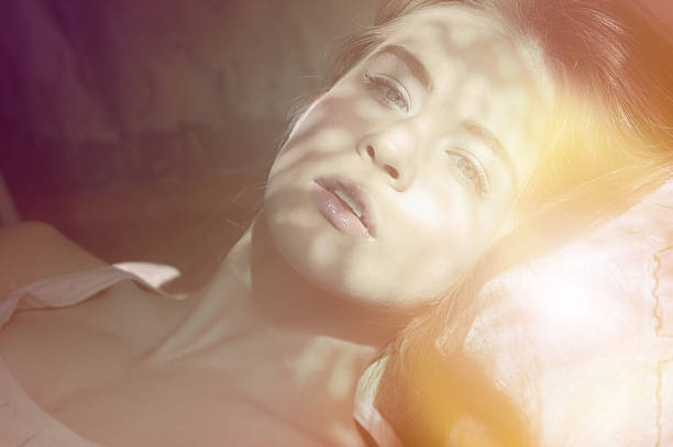 istock girl lying on the bed 534559750