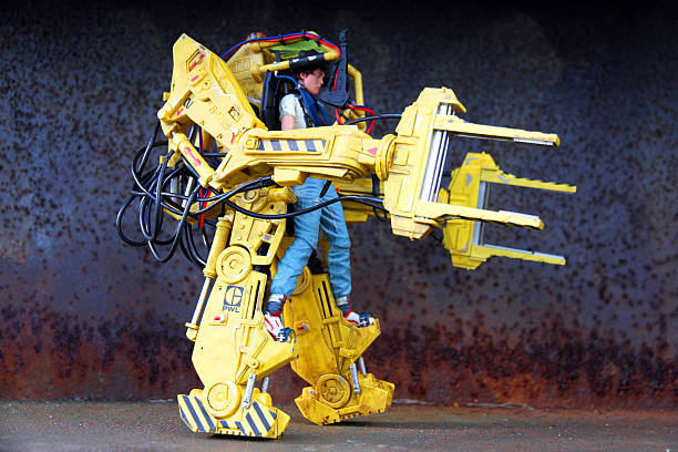 Heavy Lifting Vancouver, Canada - February 22, 2016: A model of Ellen Ripley from the "Aliens" film franchise in a Weyland Yutani power loader. The models are made by NECA. alien ripley stock pictures, royalty-free photos & images