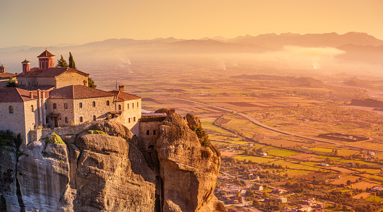 A look at the Kalambaka scenery, also called Kalabaka, where the Meteoras are in the Thessaly Plain in Greece. The monasteries were built on sandstone rock pillars.