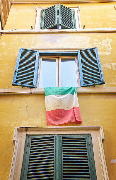 istock Traditional italian windows with  national flag 534568228