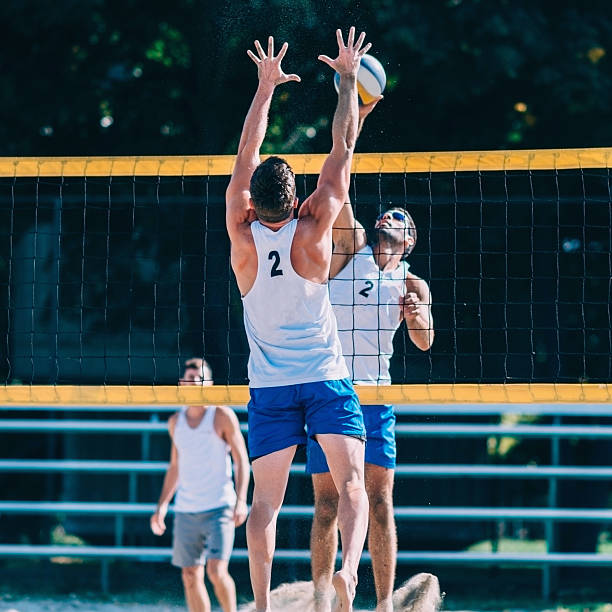 istock Beach volleyball players in action 534568378