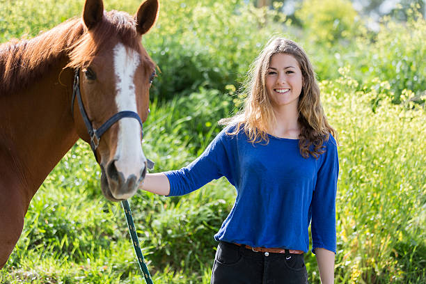 istock pretty girl with her horse 534569290