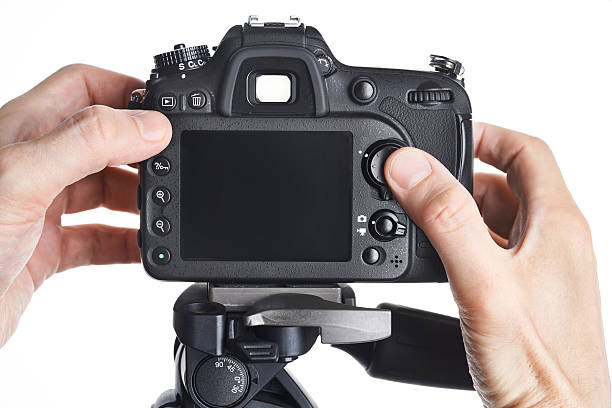istock Hands photographer adjust SLR camera isolated 534569696
