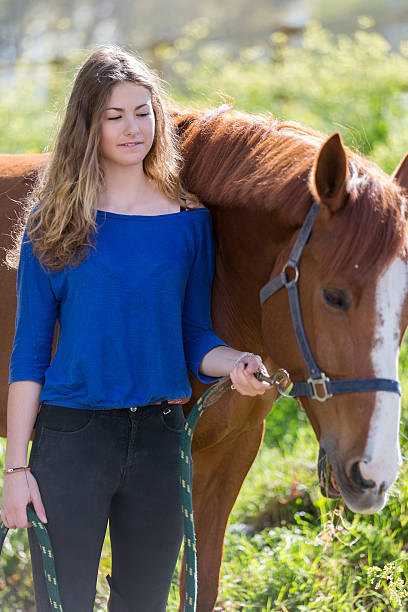 istock pretty girl with her horse 534569990