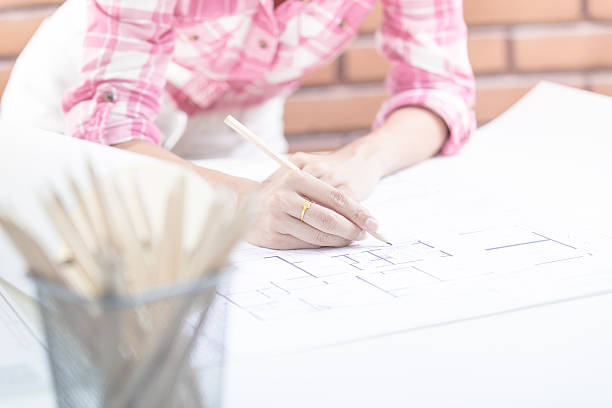 istock Architecture Woman Working Blue Print Workspace Concept 534570388